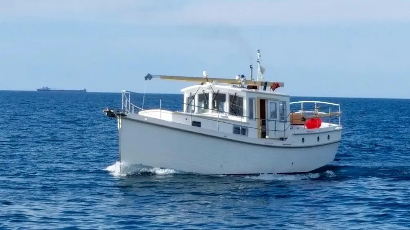 Slide: The Image of Diesel Duck 40 boat from 2013 cruising on open sea. - 2