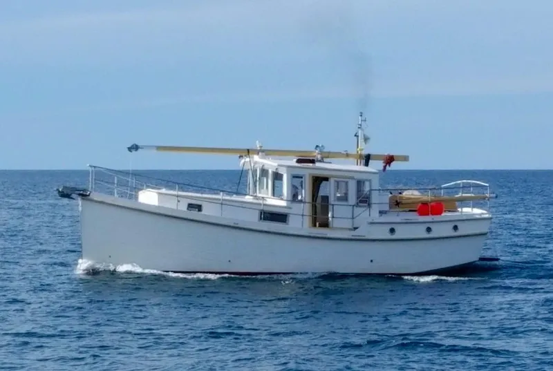 Slide: The Image of 2013 Diesel Duck 40 boat cruising on open sea. - 3