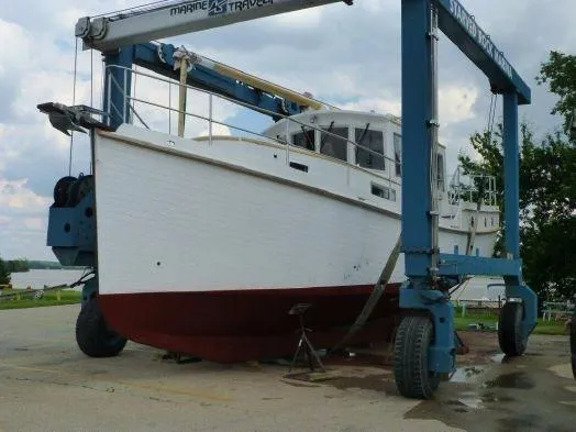 Slide: The Image of Diesel Duck 40 boat from 2013 on a marine travel lift. - 31