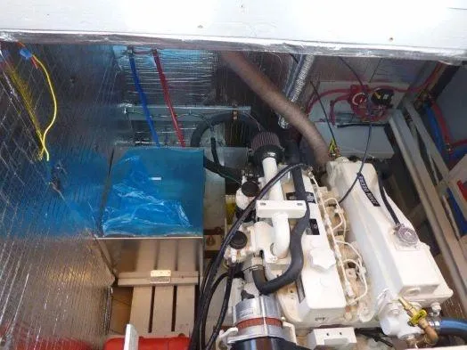 Slide: The Image of Engine room of a 2013 Diesel Duck 40 boat, showcasing mechanical components and wiring. - 35