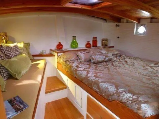 Slide: The Image of Cozy cabin interior of 2013 Diesel Duck 40 with elegant bedding and decorative vases. - 43