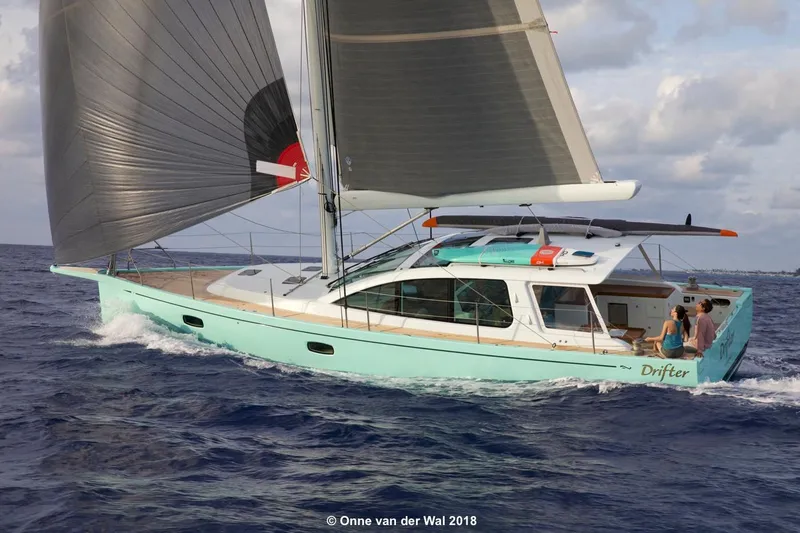 Slide: The Image of Sailing yacht Surfari 50, 2025 model, cruising on open sea with full sails. - 1