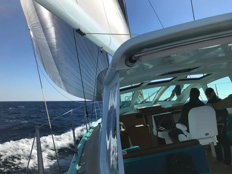 Slide: The Image of Sailing on a 2025 Surfari 50 yacht, gliding through the ocean under clear skies. - 18