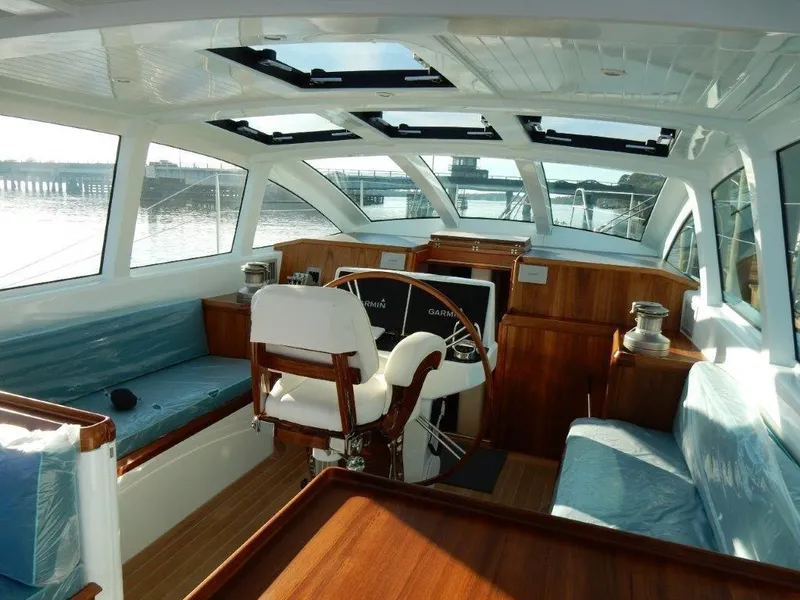 Slide: The Image of Luxurious interior of 2025 Surfari 50 yacht with panoramic windows and elegant wood finishes. - 31
