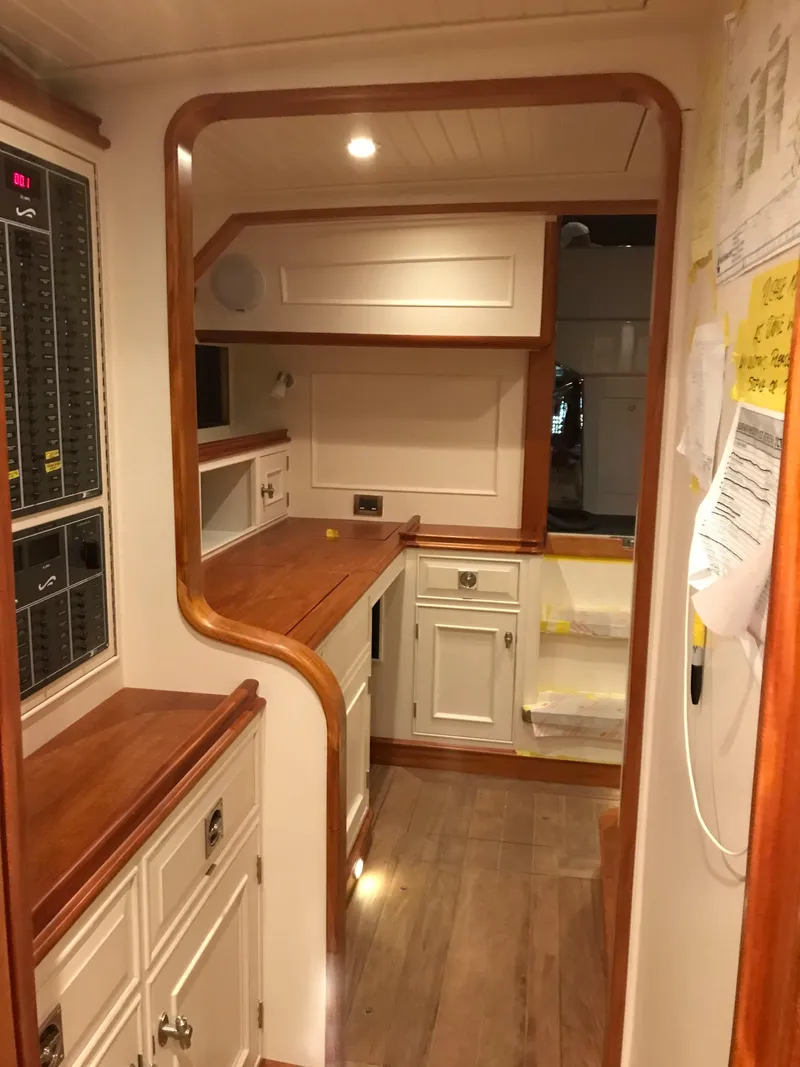 Slide: The Image of 2025 Surfari 50 yacht interior with wooden cabinetry and modern design. - 35