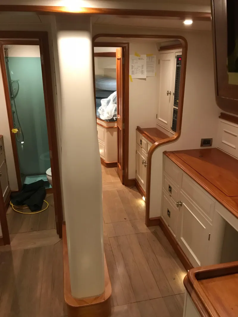 Slide: The Image of Interior of 2025 Surfari 50 yacht, featuring wooden cabinetry and modern design. - 36