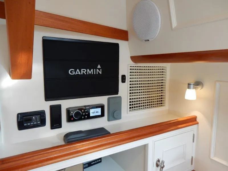 Slide: The Image of Interior of 2025 Surfari 50 yacht with Garmin navigation system and modern controls. - 40