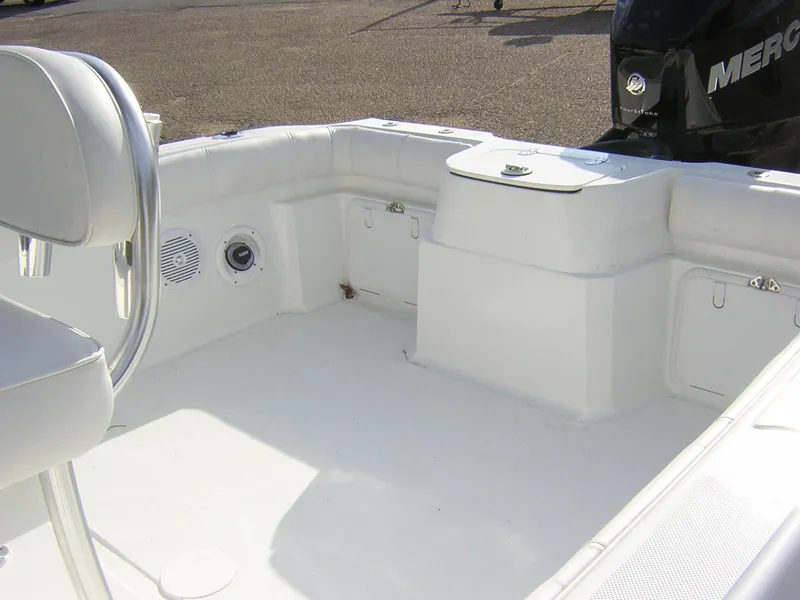 Slide: The Image of Interior of a 2017 Glasstream 240 boat, white upholstery and storage area. - 9