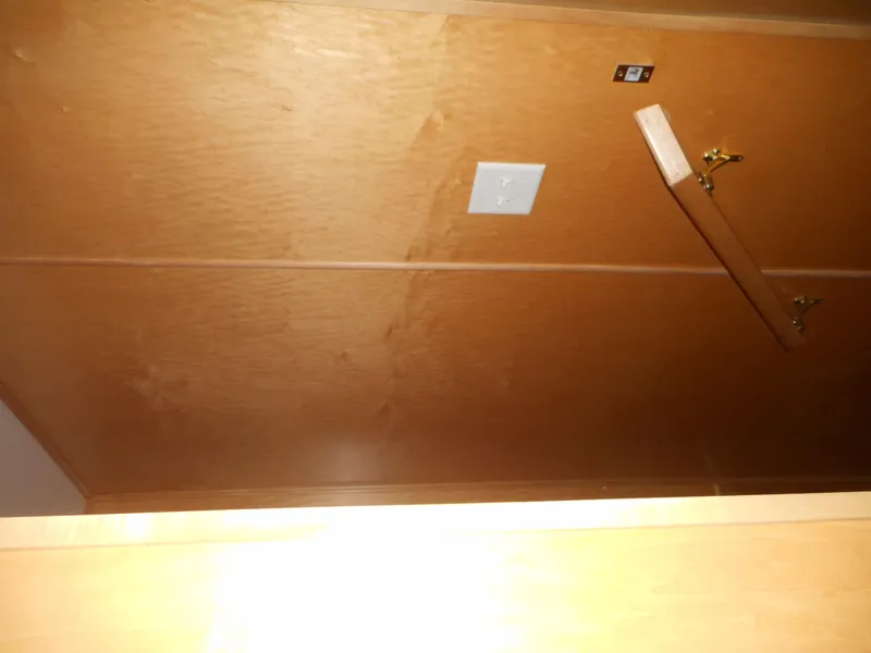 Slide: The Image of Wooden interior cabinet of 2003 Stardust Cruisers Summer Haven Trip 33 with open door. - 11