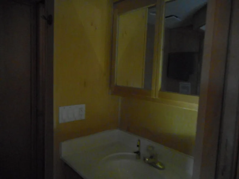 Slide: The Image of Bathroom sink area in 2003 Stardust Cruisers Summer Haven Trip 33 houseboat. - 12