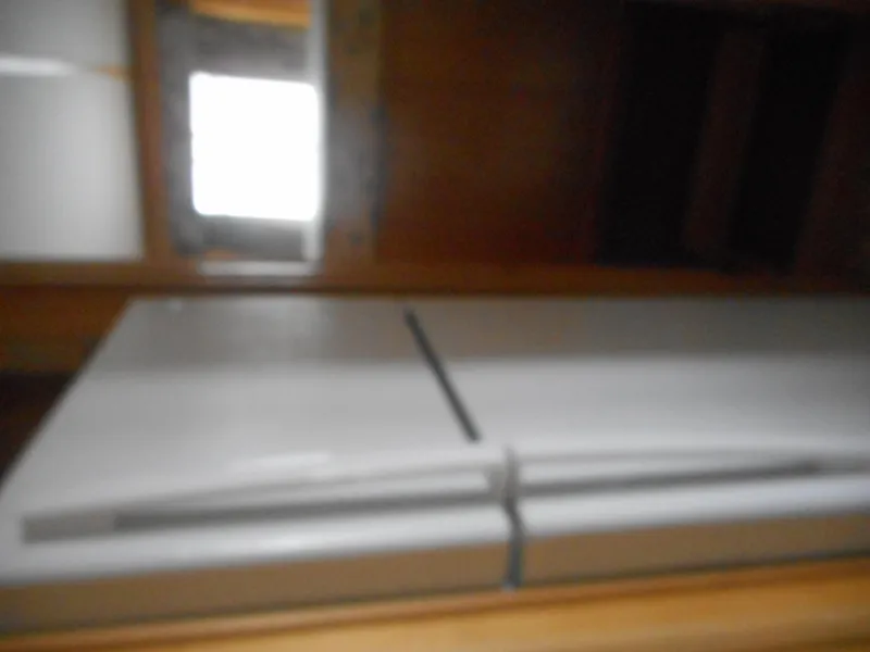 Slide: The Image of 2003 Stardust Cruisers Summer Haven Trip 33 interior with refrigerator and wooden cabinets. - 16