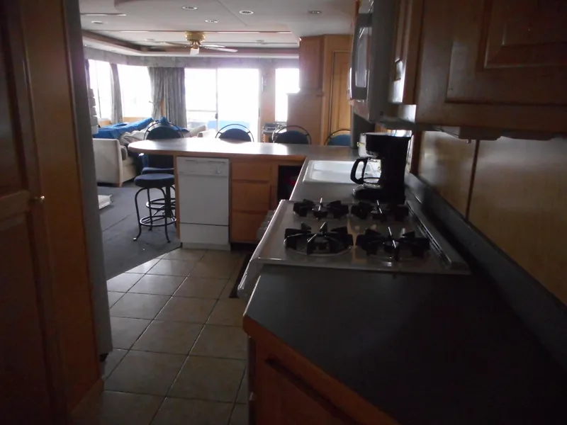 Slide: The Image of Interior of 2003 Stardust Cruisers Summer Haven Trip 33 houseboat kitchen and living area. - 17
