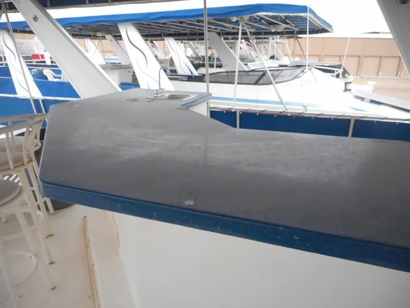 Slide: The Image of 2003 Stardust Cruisers Summer Haven Trip 33 boat interior with docked boats in background. - 29