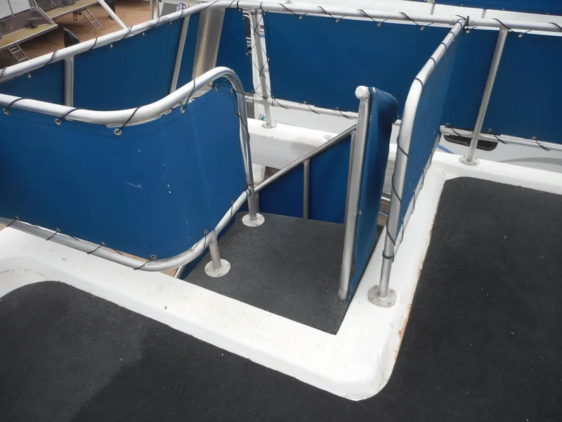 Slide: The Image of Staircase on 2003 Stardust Cruisers Summer Haven Trip 33 houseboat with blue railings. - 32