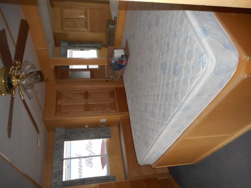 Slide: The Image of Bedroom interior of 2003 Stardust Cruisers Summer Haven Trip 33 houseboat. - 7