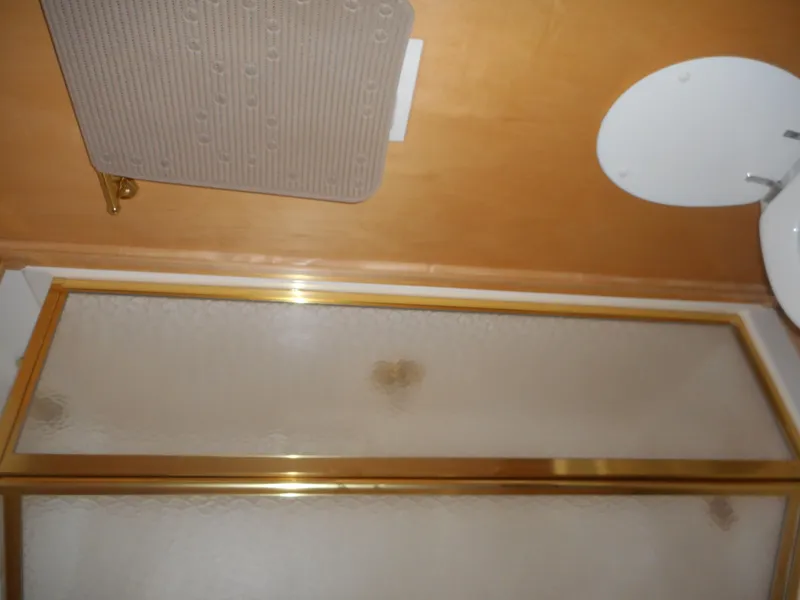 Slide: The Image of Bathroom in 2003 Stardust Cruisers Summer Haven Trip 33 with shower and sink. - 9