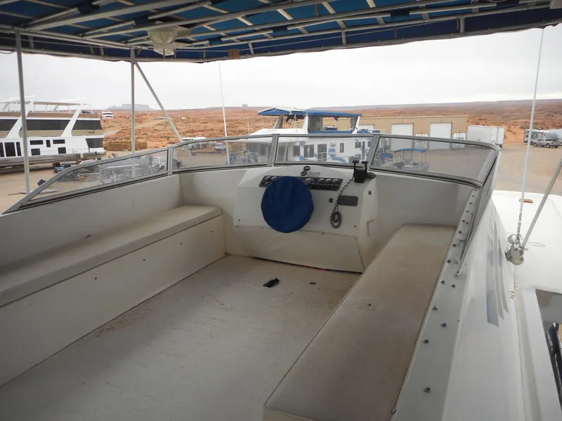 Slide: The Image of 2003 Stardust Cruisers Summer Haven Share #34 & 35 houseboat interior with seating and control panel. - 22