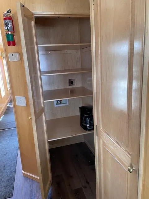 Slide: The Image of Open pantry with wooden shelves in 2003 Stardust Cruisers Summer Haven Share #34 & 35. - 23