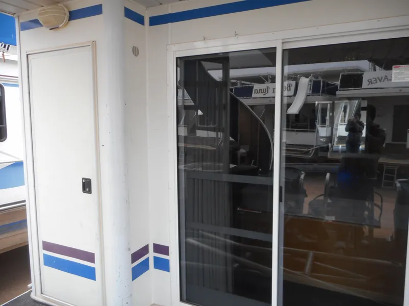 Slide: The Image of 2003 Stardust Cruisers Summer Haven Share #34 & 35 houseboat exterior with sliding glass door. - 9