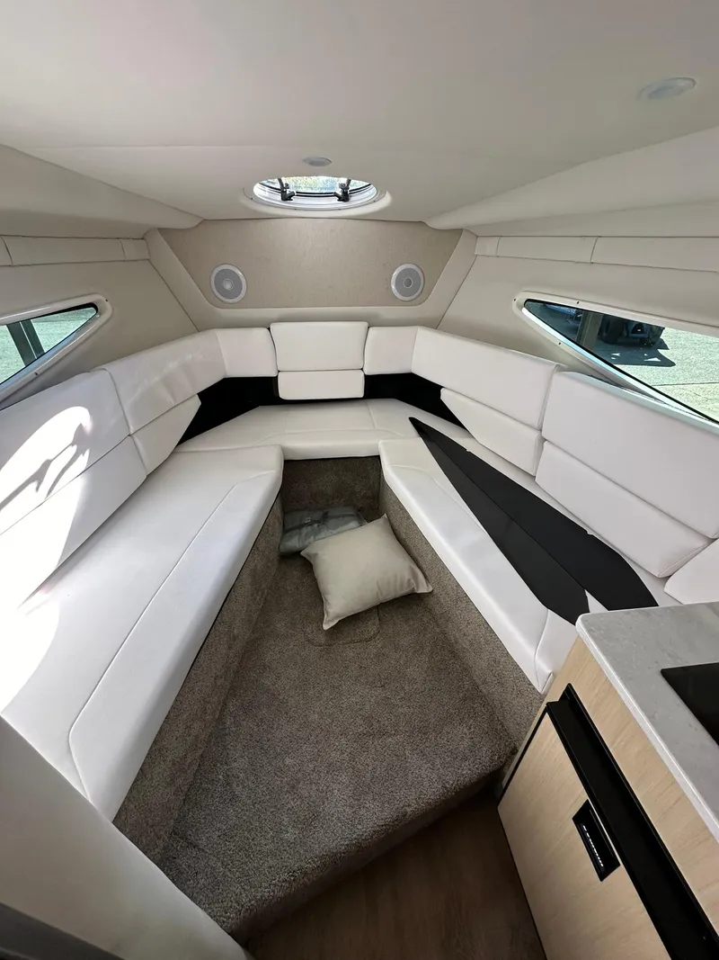 Slide: The Image of Compact bathroom in 2025 Regal 26XO boat with toilet and shower. - 24