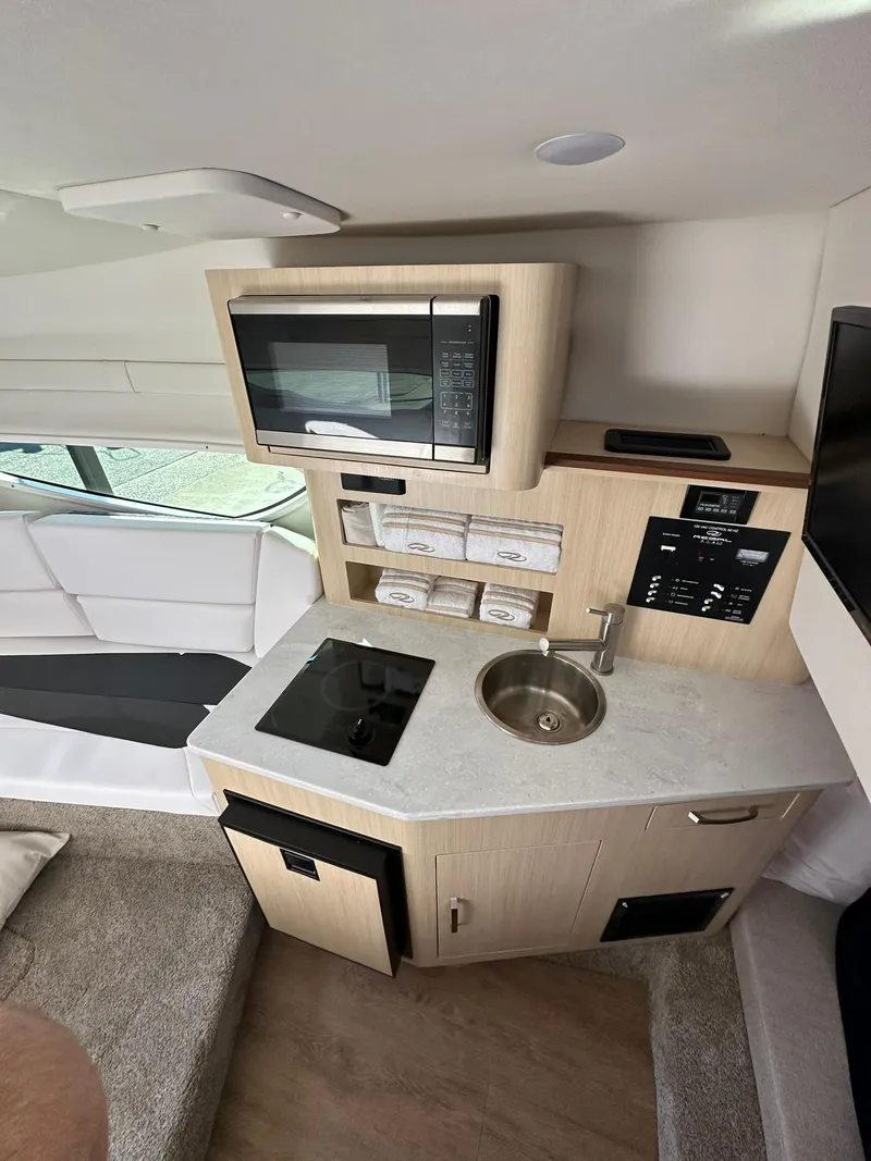 Slide: The Image of Luxurious interior of 2025 Regal 26XO boat with plush seating and modern design. - 25