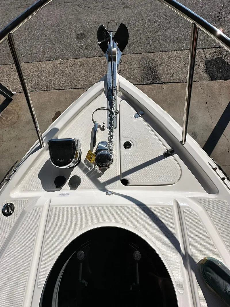 Slide: The Image of 2025 Regal 26XO boat deck view at marina. - 29