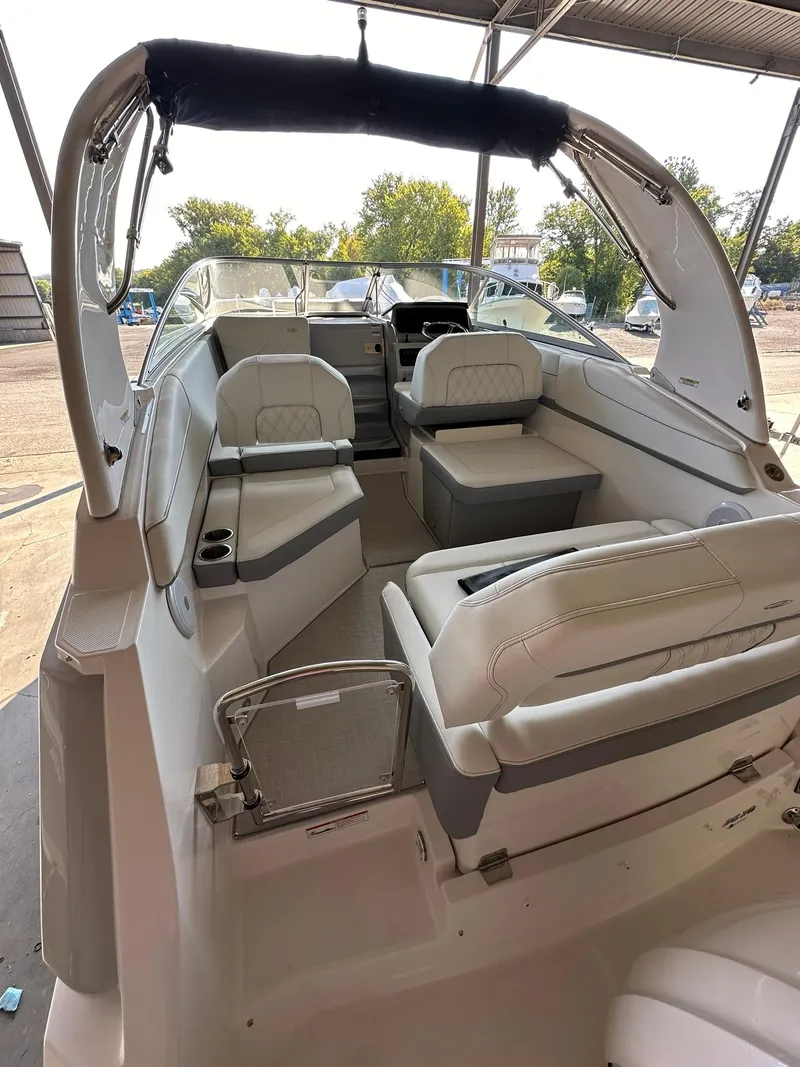 Slide: The Image of 2025 Regal 26XO boat on trailer in warehouse setting. - 6