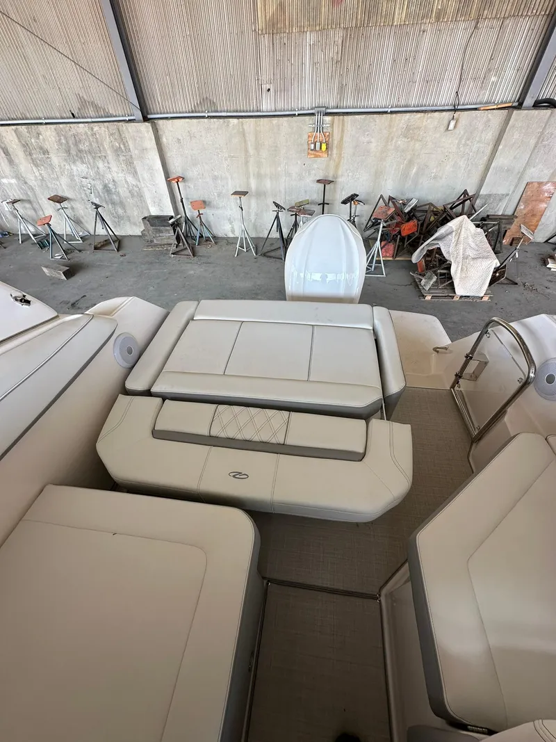 Slide: The Image of 2025 Regal 26XO boat interior with spacious seating in a storage area. - 9