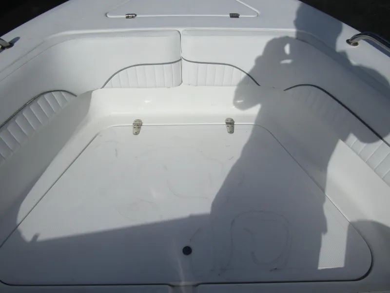 Slide: The Image of 2006 Sea Pro 206 Dual Console boat interior with seating and shadow. - 11