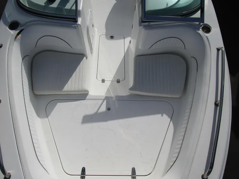Slide: The Image of 2006 Sea Pro 206 Dual Console boat interior with seating and storage compartments. - 13