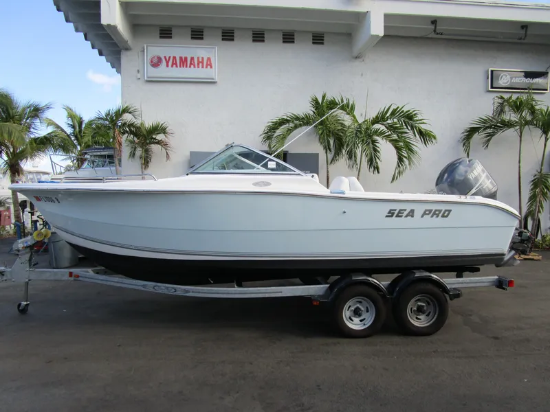 Slide: The Image of 2006 Sea Pro 206 Dual Console boat on trailer outside Yamaha building. - 2