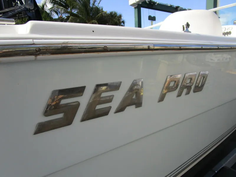 Slide: The Image of 2006 Sea Pro 206 Dual Console boat side view with logo. - 24