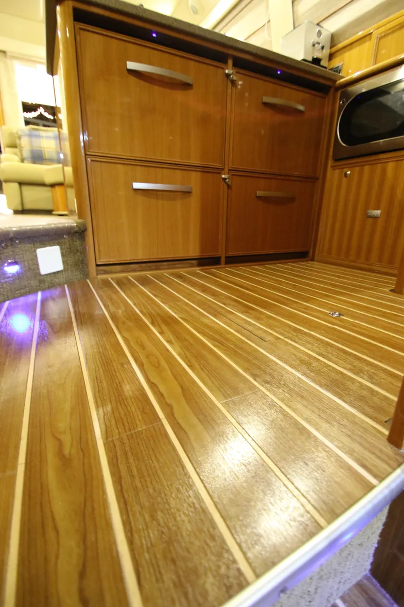 Slide: The Image of Interior of 2008 Riviera 47 Open Flybridge with wooden flooring. - 18