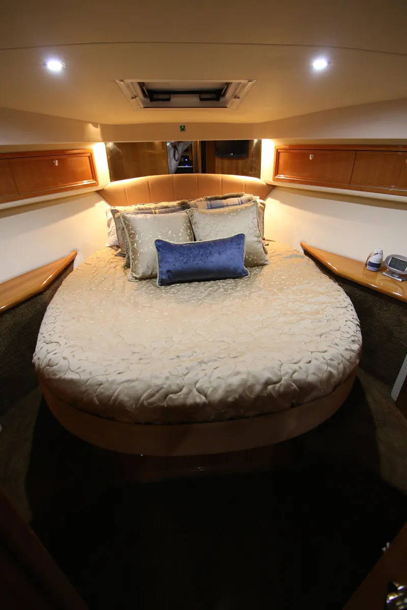 Slide: The Image of Luxurious bedroom in a 2008 Riviera 47 Open Flybridge yacht. - 24