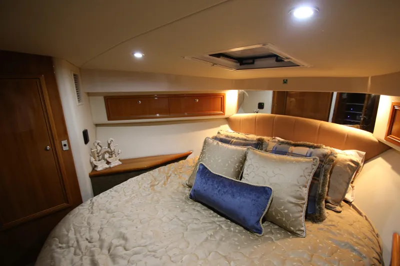 Slide: The Image of Luxurious bedroom in a 2008 Riviera 47 Open Flybridge yacht. - 26