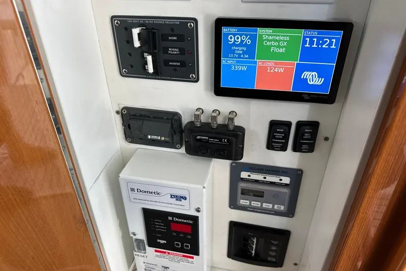 Slide: The Image of Control panel of a 2008 Riviera 47 Open Flybridge Series II yacht, displaying battery and system status. - 3