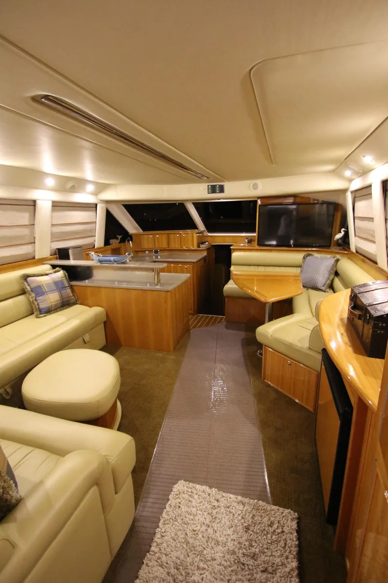 Slide: The Image of Interior of 2008 Riviera 47 Open Flybridge Series II, featuring luxurious design. - 4