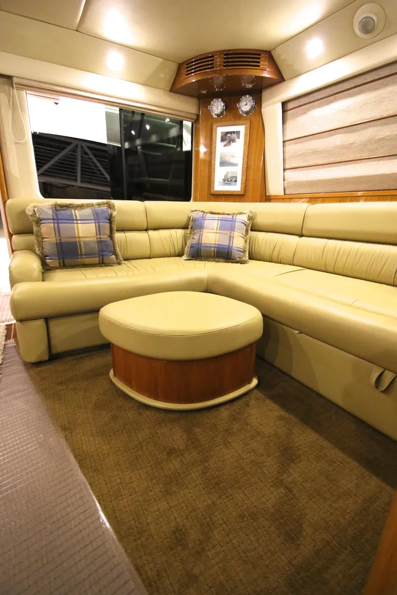 Slide: The Image of Luxurious interior of 2008 Riviera 47 Open Flybridge with beige sofa. - 9