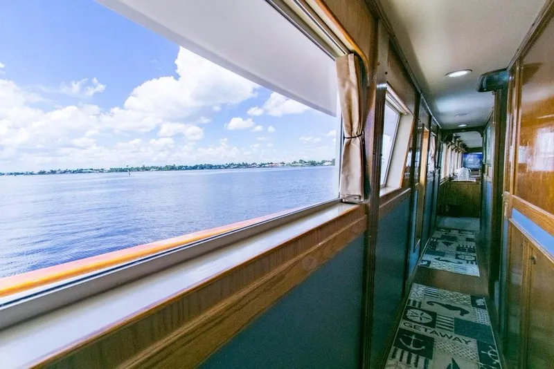 Slide: The Image of Interior hallway view of 1983 Benetti Custom Lloyds M.Y. yacht with ocean scenery. - 17