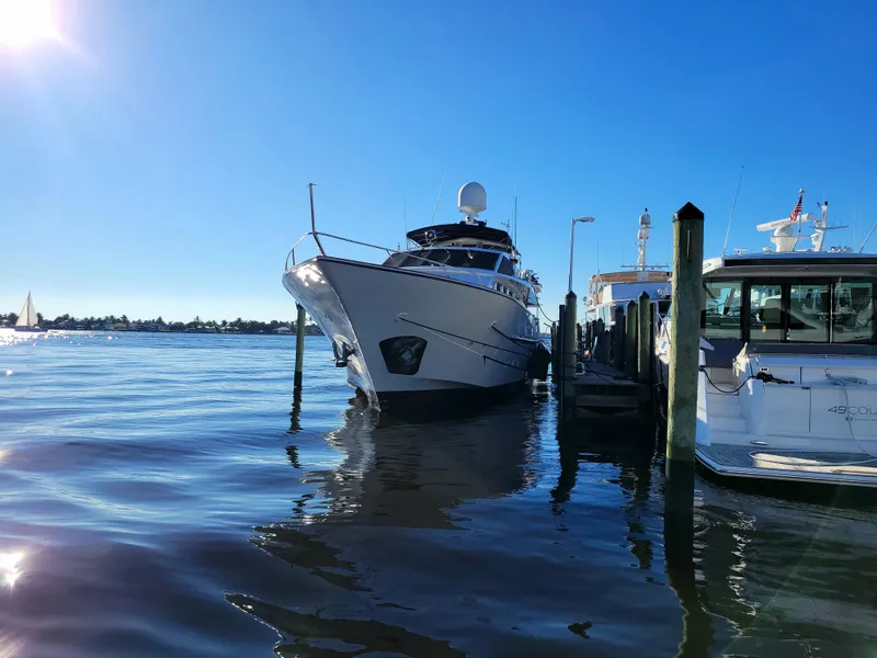 Slide: The Image of Benetti Custom Lloyds M.Y. 1983 yacht docked at a marina on a sunny day. - 2