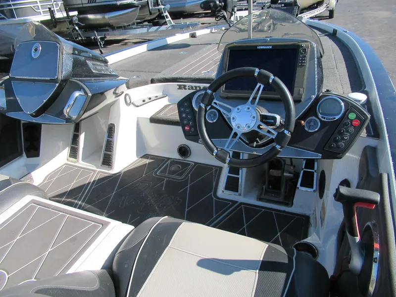 Slide: The Image of 2017 Ranger Z521C DC RANGER CUP PKG. boat cockpit with steering wheel and control panel. - 2