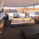 Slide: The Image of Spacious upper deck of 2011 Bravada Knot A Problem houseboat with modern seating. - 12