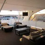 Slide: The Image of Luxurious seating area on the 2011 Bravada Knot A Problem yacht with modern furniture. - 13