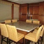 Slide: The Image of Dining area in 2011 Bravada Knot A Problem houseboat with granite table and wicker chairs. - 5