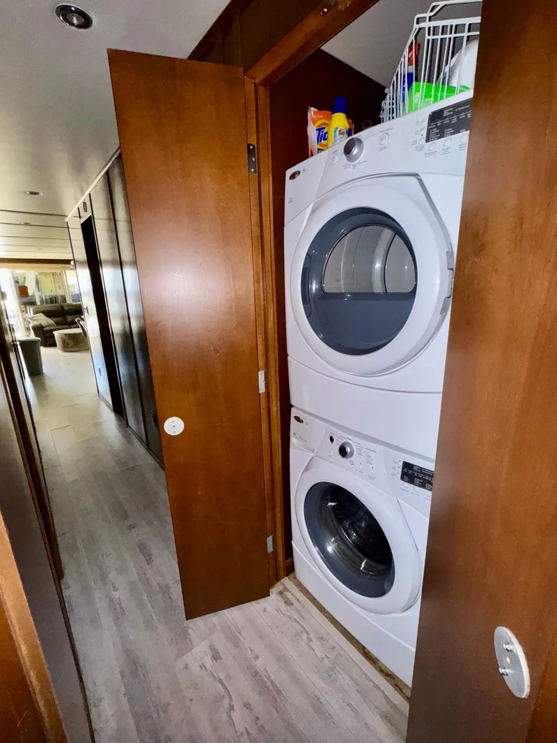 Slide: The Image of Stacked washer and dryer in a compact laundry area on a 2013 Bravada Bella Luna Share #8. - 13