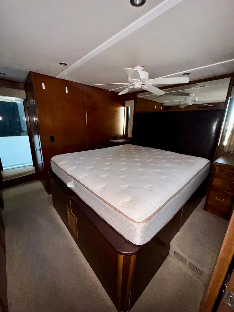 Slide: The Image of Bedroom interior of 2013 Bravada Bella Luna Share #8 with a large bed and ceiling fan. - 17