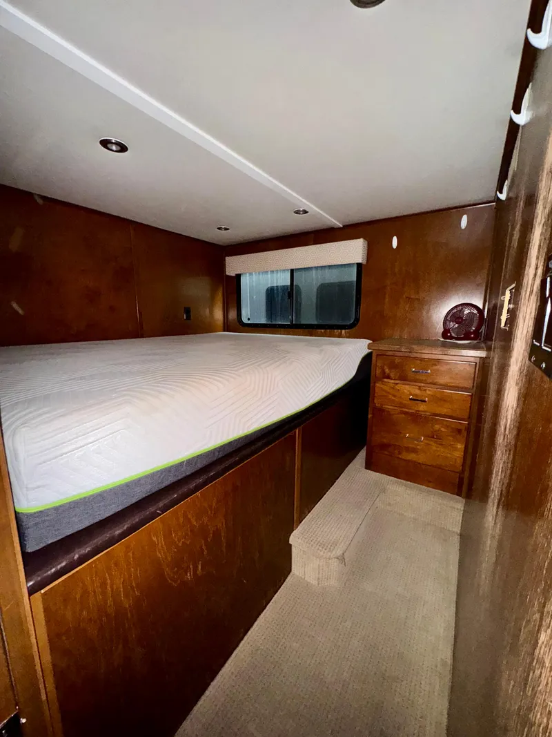 Slide: The Image of Interior of 2013 Bravada Bella Luna Share #8, featuring a cozy wooden bedroom. - 9