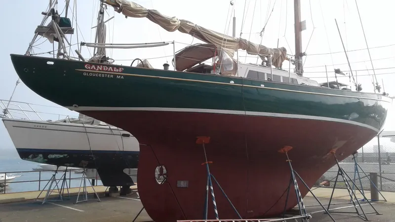 Slide: The Image of 1960 Frans Maas-LeFevre One Off Custom 47 sailboat in dry dock, green hull, red keel. - 1