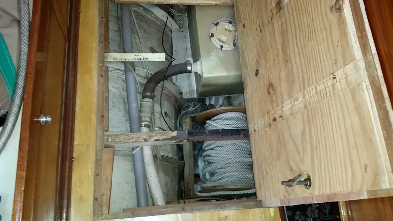 Slide: The Image of Interior view of a 1960 Frans Maas-LeFevre One Off Custom 47 sailboat, showing storage and piping. - 10