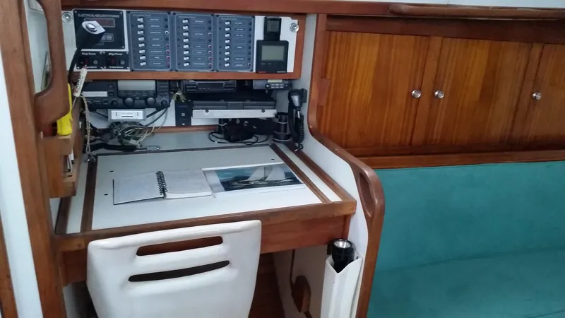 Slide: The Image of Navigation station on a 1960 Frans Maas-LeFevre One Off Custom 47 sailboat, featuring control panels and seating. - 12